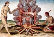Indios cocinando pescado. Grabado de 'Admirante Narratio Americae' por Theodore de Bry (1528-1598).