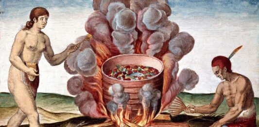 Indios cocinando pescado. Grabado de 'Admirante Narratio Americae' por Theodore de Bry (1528-1598).
